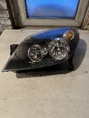 Фара головного освещения левая Hella на Opel Astra H
